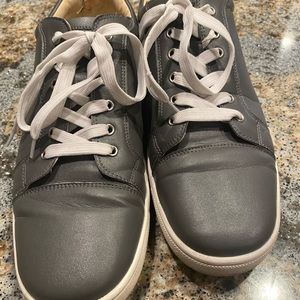 CHRISTIAN LOUBOUTIN - Gray leather sneakers.
